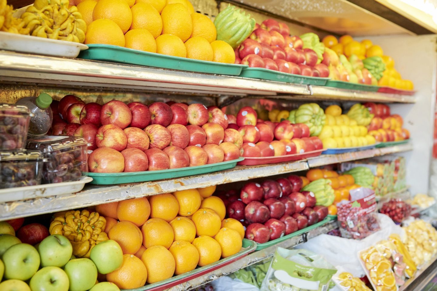 Shelves with fruits at grocery store